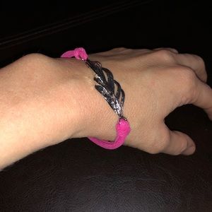 Pink bracelet with silver feather